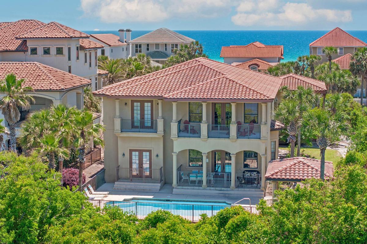 Sandcastle Dreams Mediterranean-style vacation home exterior with private pool in Destiny West