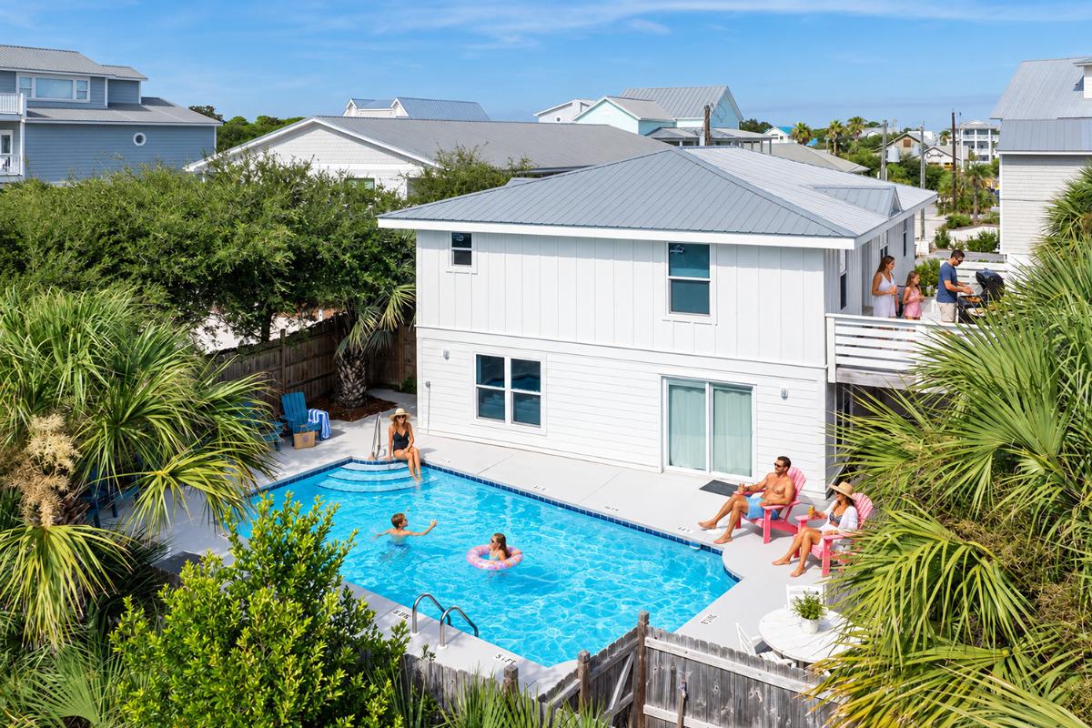 Laid Back vacation home in Grayton Beach with a large private pool, family swimming, and outdoor grilling area near the beach.