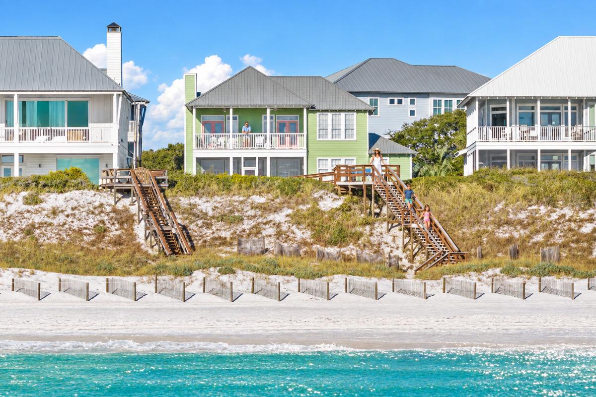 Shore-E-Nuff Gulf-front 30A vacation home in Old Florida Beach with private beach walkover and family heading down to the sand.